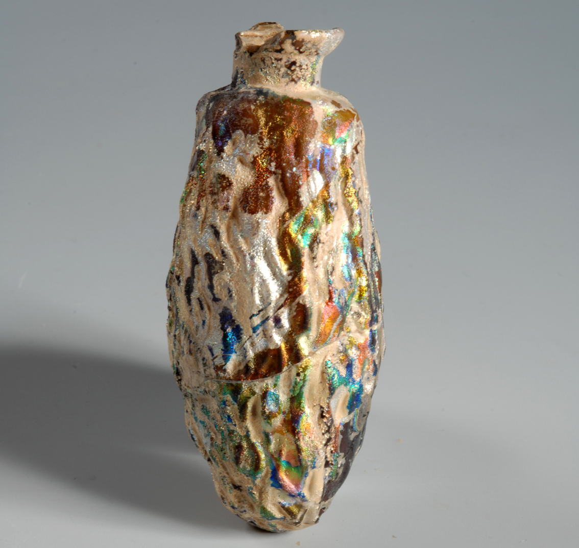 Unguentario a forma di dattero. Da Cipro, metà del I secolo-inizi del II secolo d.C. (prima et. imperiale); vetro, H 7 cm, diametro 3 cm (Torino, Musei Reali − Museo di Antichità, donazione Arturo Palma di Cesnola 2005, inv. 89188)